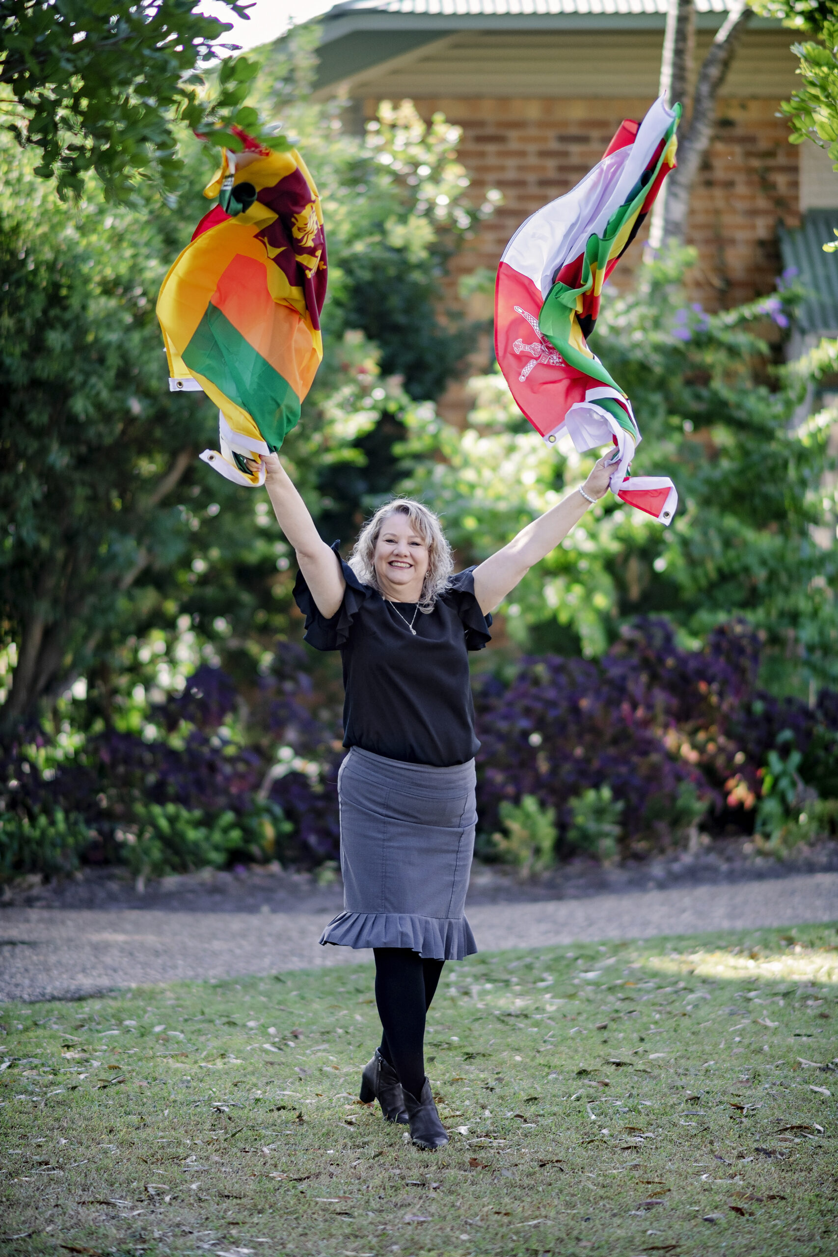 Tracey Wigmore waving flags